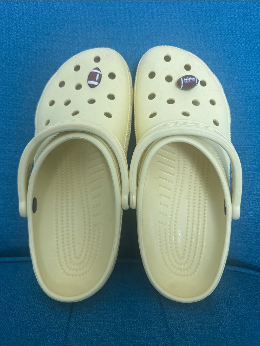 Men’s 9 womens 12 yellow Crocs with Football Charm